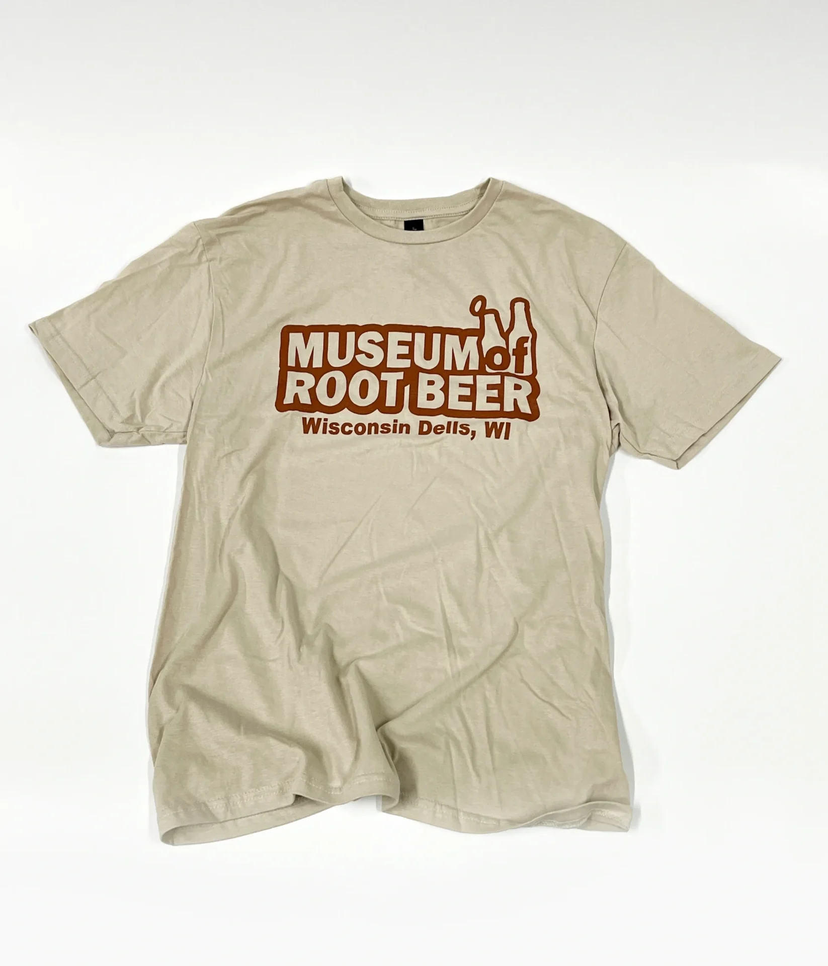 Logo T-shirt in beige with "Museum of Root Beer, Wisconsin Dells, WI" printed in brown text and featuring two root beer bottle outlines.