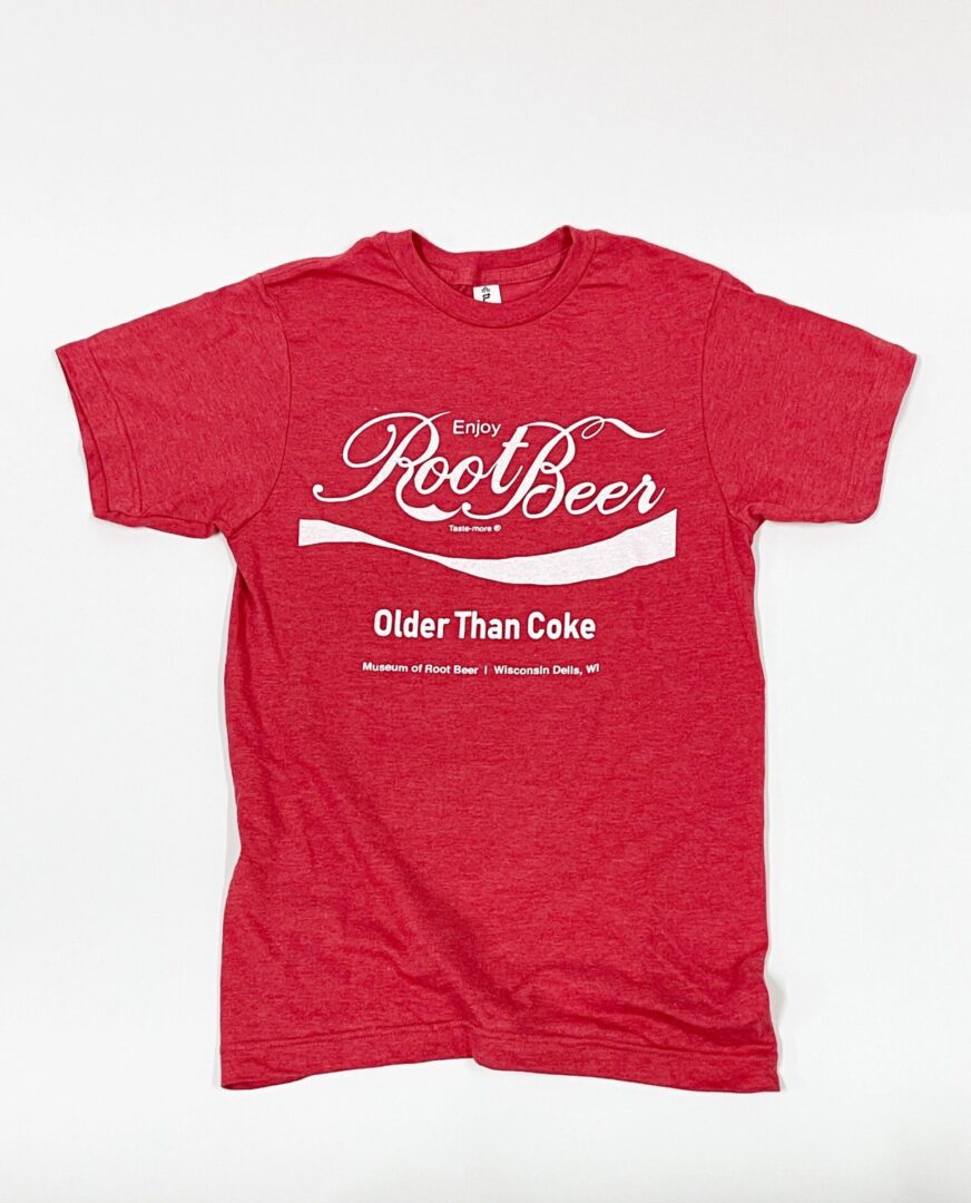 Older Than Coke T-shirt in red, featuring white text that reads: "Enjoy Root Beer, Older Than Coke, Museum of Root Beer, Wisconsin Dells, WI." An ideal choice for enthusiasts of the beer museum.