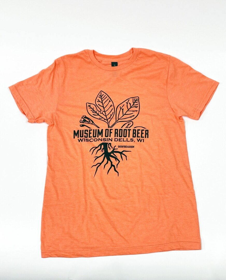 Roots & Leaves T-shirt in orange, featuring a plant with roots design and the text "Museum of Root Beer, Wisconsin Dells, WI." Perfect for celebrating your enthusiasm for the one-of-a-kind beer museum experience.