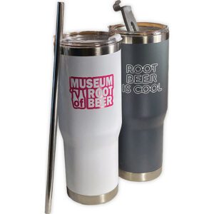 Two white 30 oz tumblers with clear lids and a metal straw; one reads “MUSEUM OF ROOT BEER,” the other “ROOT BEER IS COOL.”.